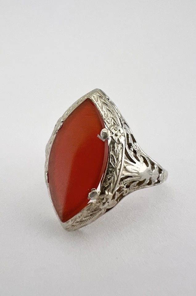 ANTIQUE ART DECO 14K WHITE GOLD MARQUISE CUT CARNELIAN FILAGREE RING: ANTIQUE ART DECO 14K WHITE GOLD MARQUISE CUT CARNELIAN FILAGREE RING Antique Art Deco 14K White Gold Marquise Cut Carnelian Filagree Ring Size: 7.75 - Can Be Sized Without Damaging Weight is 3.1 Grams