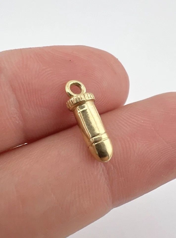 CUSTOM FINE 14K YELLOW GOLD BULLET CHARM PENDANT 5/8" - 2G: CUSTOM FINE 14K YELLOW GOLD BULLET CHARM PENDANT 5/8" - 2G Custom Fine 14k Yellow Gold Bullet Charm Pendant 5/8" - 2g Size: 5/8" Tall with Bail by About 1/4" Wide Metal: 14k Yellow Gold - Tested Weigh