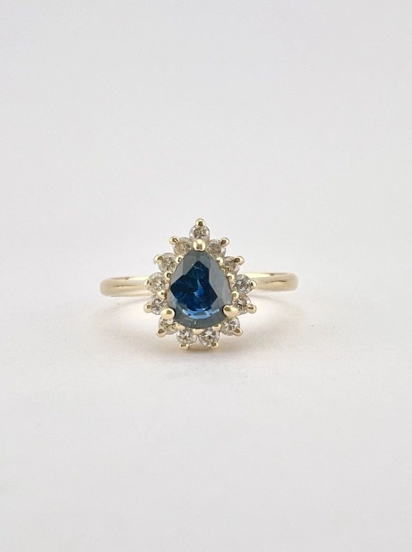 DESIGNER 14K YELLOW GOLD NATURAL BLUE SAPPHIRE & DIAMOND ACCENT HALO RING: Designer 14K Yellow Gold Natural Blue Sapphire & Diamond Accent Halo Ring Size: 5.- Can be Resized Weight is 2.1 Grams on my scale Metal: 14k Yellow Gold - Hallmarked Amazing Natural Blue Sapphire and