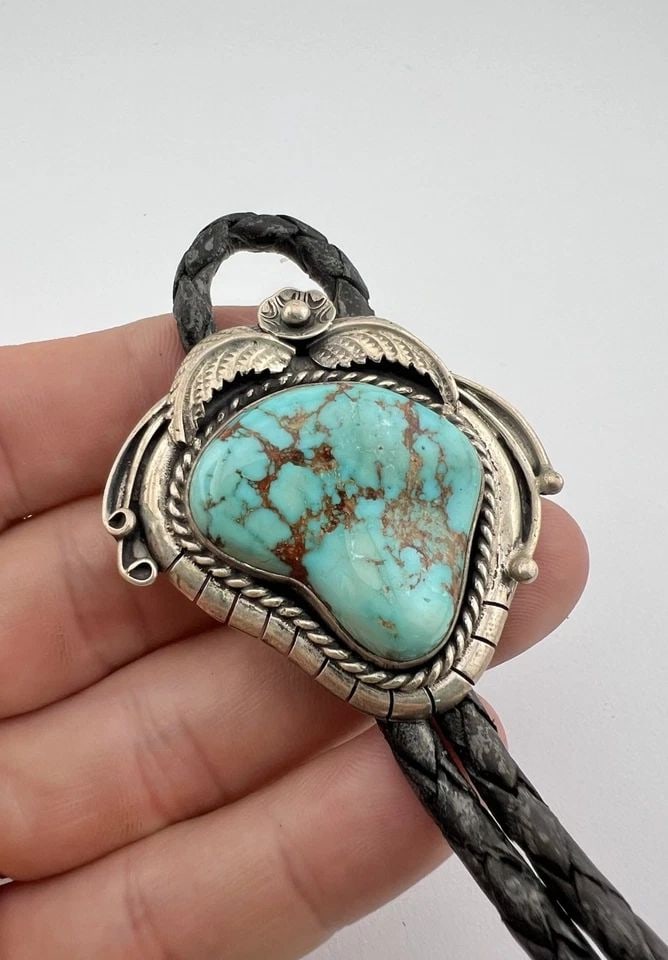 VTG TONY GUERRO NAVAJO STERLING SILVER ROYSTON TURQUOISE STAMPED BOLO TIE: VTG TONY GUERRO NAVAJO STERLING SILVER ROYSTON TURQUOISE STAMPED BOLO TIE Vtg Tony Guerro Navajo Sterling Silver Royston Turquoise Stamped Bolo Tie Size: 1 7/8" Tall by 1 7/8" Wide Weight is 45.6 Gram