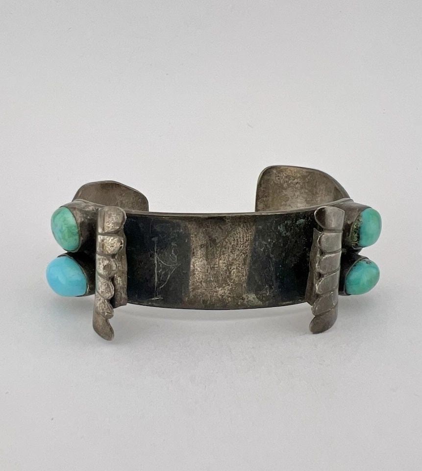 OLD PAWN NAVAJO STERLING SILVER GREEN TURQUOISE STAMPED WATCH CUFF BRACELET -49G: OLD Pawn Navajo Sterling Silver Green Turquoise Stamped Watch Cuff Bracelet -49g Cuff is 5 3/8" tip to Tip and has a 1 1/8" Wide Adjustable Gap Cuff Is 3/4" Wide In the Center Weight is 49.0 Grams on 