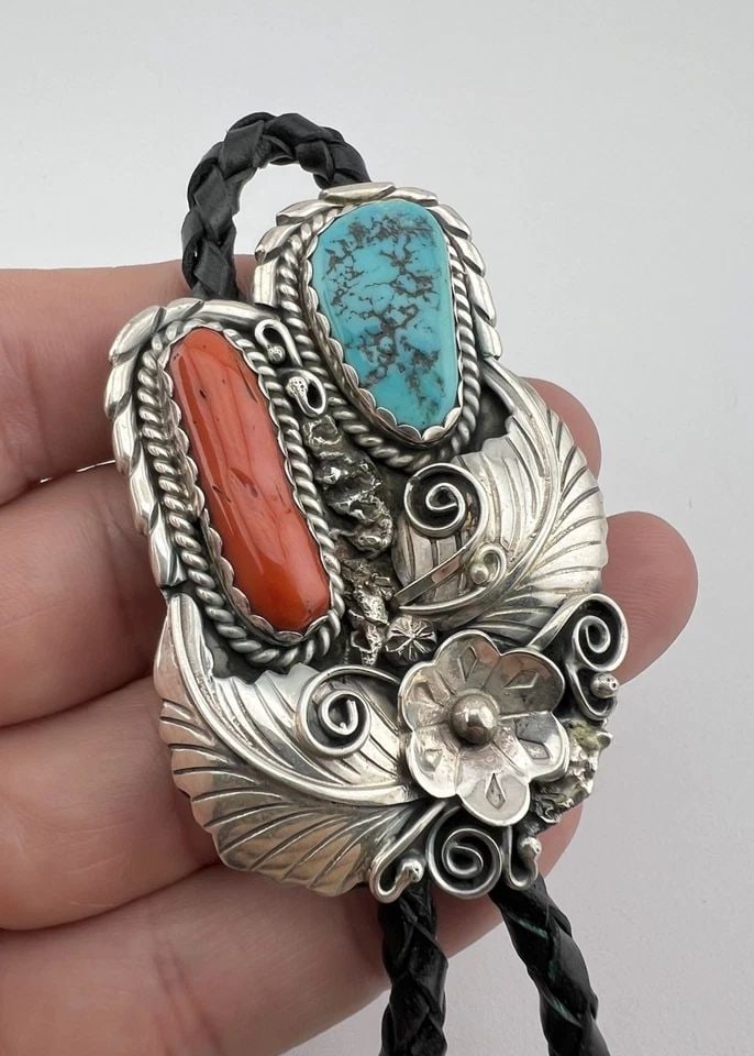 VTG R.TOM NAVAJO STERLING SILVER TURQUOISE & RED CORAL STAMPED BOLO TIE 2.5": VTG R.TOM NAVAJO STERLING SILVER TURQUOISE & RED CORAL STAMPED BOLO TIE 2.5" Vtg R.Tom Navajo Sterling Silver Turquoise & Red Coral Stamped Bolo Tie 2.5" Size: 2 1/2" Tall by 1 5/8" Wide Weight is 45.