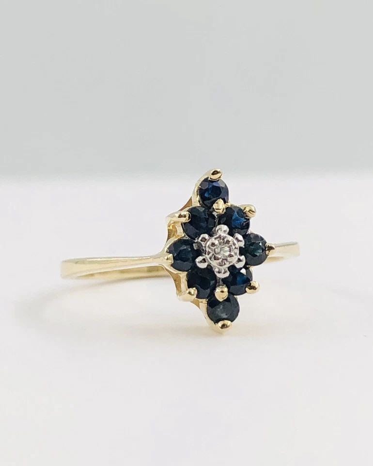 DESIGNER 14K YELLOW GOLD NATURAL BLUE SAPPHIRE & DIAMOND ACCENT CLUSTER RING: DESIGNER 14K YELLOW GOLD NATURAL BLUE SAPPHIRE & DIAMOND ACCENT CLUSTER RING Designer 14K Yellow Gold Natural Blue Sapphire & Diamond Accent Cluster Ring Size: 5.25 - Can be Resized With Out Damage We
