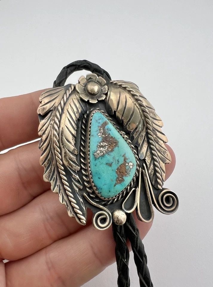 VTG NAVAJO STERLING SILVER BLUE GEM TURQUOISE STAMPED LEAF BOLO TIE & DANGLE TIP: VTG NAVAJO STERLING SILVER BLUE GEM TURQUOISE STAMPED LEAF BOLO TIE & DANGLE TIP Vtg Navajo Sterling Silver Blue Gem Turquoise Stamped Leaf Bolo Tie & Dangle Tips Size: 2 1/8" Tall by 1 3/4" Wide Weig
