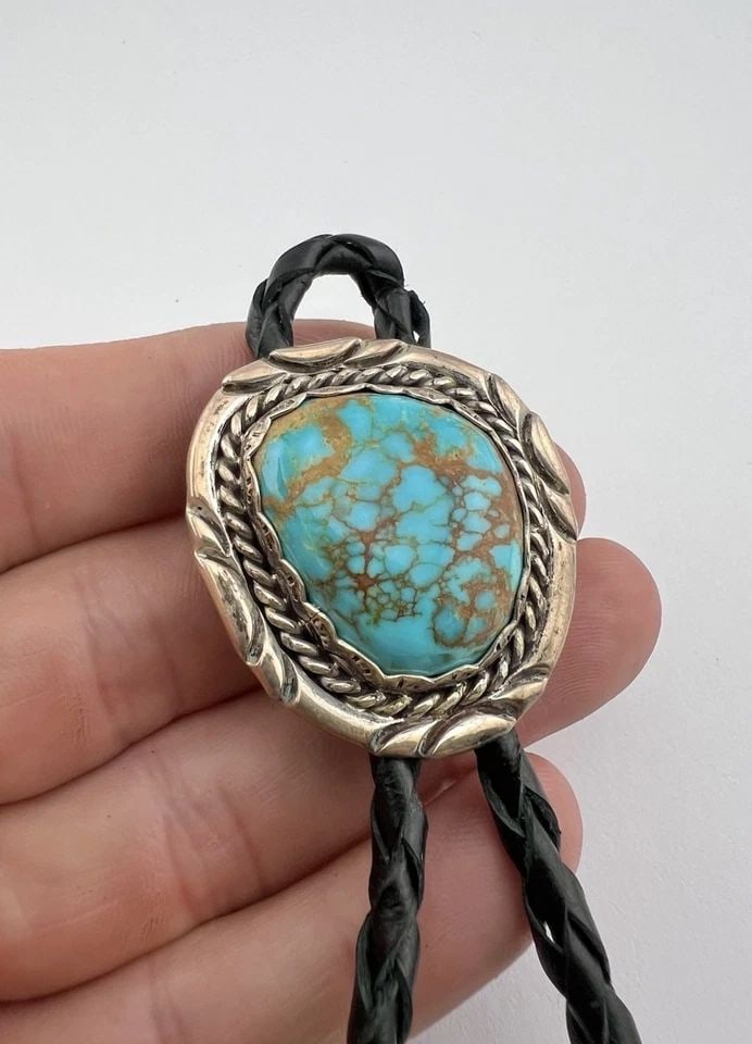 VINTAGE NAVAJO STERLING SILVER ROYSTON TURQUOISE STAMPED OVAL BOLO TIE: VINTAGE NAVAJO STERLING SILVER ROYSTON TURQUOISE STAMPED OVAL BOLO TIE Vintage Navajo Sterling Silver Royston Turquoise Stamped Oval Bolo Tie Size: 1 1/2" Tall by 1 3/8" Wide Weight is 31.9 Grams on m