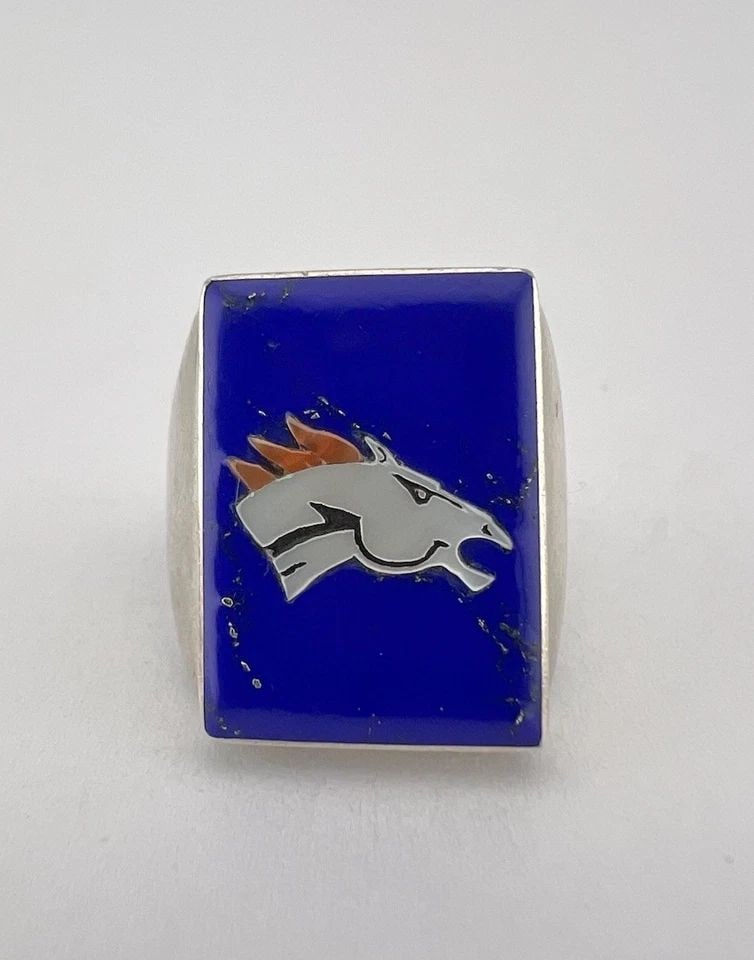 VTG BOBBY CONCHO ZUNI MULTI-INLAY STERLING SILVER DENVER BRONCOS FOOTBALL RING: VTG BOBBY CONCHO ZUNI MULTI-INLAY STERLING SILVER DENVER BRONCOS FOOTBALL RING Vtg Bobby Concho Zuni Multi-Inlay Sterling Silver Denver Broncos Football Ring Ring Size: 10.5 - Can Be Re Sized Weight i