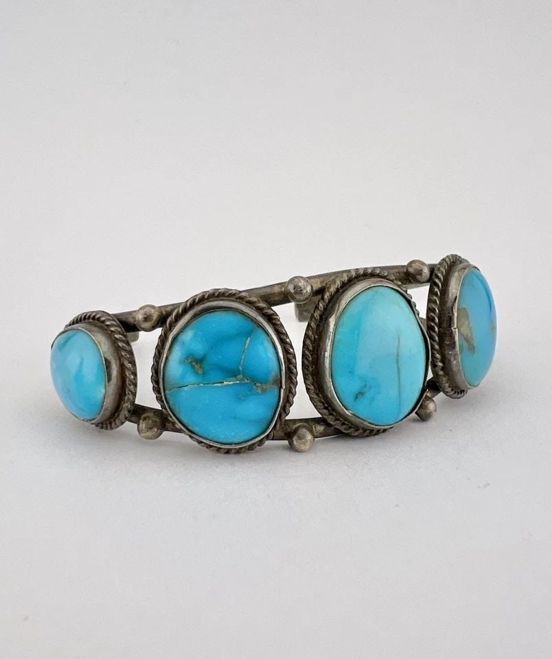 VTG NAVAJO STERLING SILVER BLUE GEM TURQUOISE 5 STONE WOMEN'S CUFF BRACELET: Vtg Navajo Sterling Silver Blue Gem Turquoise 5 Stone Women's Cuff Bracelet Cuff is 5 1/8" tip to Tip and has a 1 1/4" Wide Adjustable Gap Cuff Is 7/8" Wide In the Center Weight is 22.6 Grams on my sc