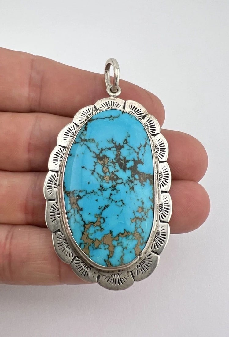 VINTAGE NAVAJO STERLING SILVER BLUE GEM TURQUOISE OVAL STAMPED PENDANT 2.75": Vintage Navajo Sterling Silver Blue Gem Turquoise Oval Stamped Pendant 2.75" Size: 2 3/4" Tall With Bail & 1 1/2" Wide Metal: Sterling Silver Weight is 17.6 Grams on my scale Amazing Natural High Grad