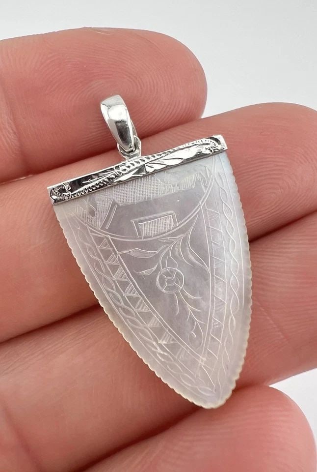 ANTIQUE 14KWHITE GOLD CARVED MOTHER OF PEARL CHINESE GAMBLING COUNTER PENDANT: ANTIQUE 14KWHITE GOLD CARVED MOTHER OF PEARL CHINESE GAMBLING COUNTER PENDANT Antique 14kWhite Gold Carved Mother Of Pearl Chinese Gambling Counter Pendant Size: 1 3/8" Tall With Bail By 3/4" Wide Met