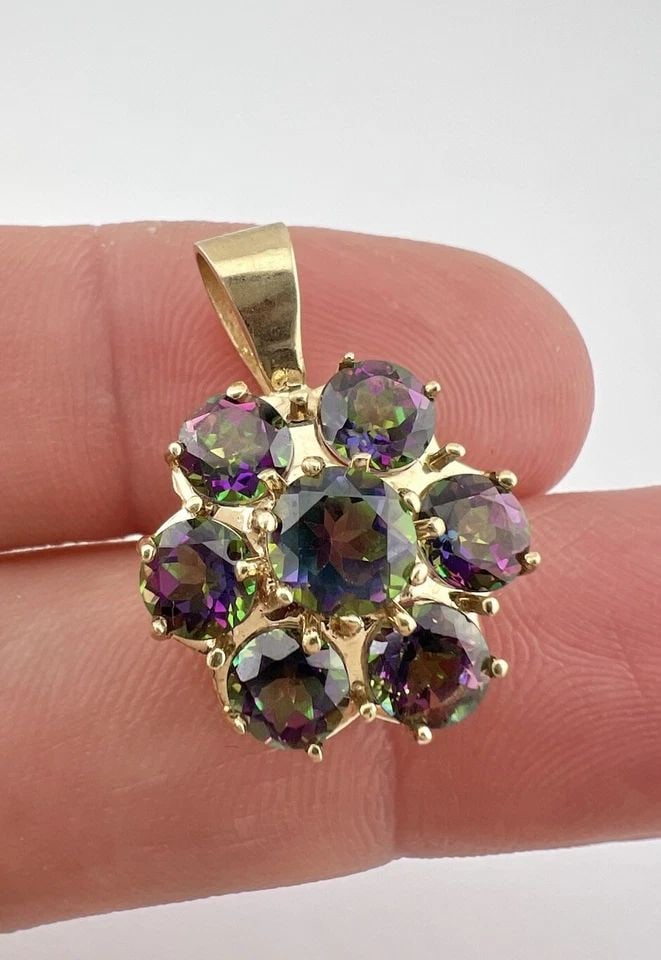 DESIGNER 10K YELLOW GOLD MYSTIC TOPAZ CLUSTER FLOWER PENDANT: DESIGNER 10K YELLOW GOLD MYSTIC TOPAZ CLUSTER FLOWER PENDANT Designer 10k Yellow Gold Mystic Topaz Cluster Flower Pendant Size: About 1" Tall With bail by 5/8" Wide Weight is 3.3 Grams on my scale Met
