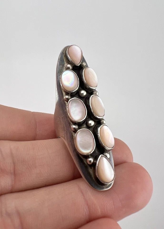 HUGE VTG NAVAJO STERLING SILVER PINK MOTHER OF PEARL CLUSTER LONG RING - 2 1/8": HUGE Vtg Navajo Sterling Silver Pink Mother Of Pearl Cluster Long Ring - 2 1/8" Ring Size: 7.25 - Can Be Re Sized Weight is 13.5 Grams on my scale Metal: Sterling Silver Ring is 2 1/8" Tall In the Cen