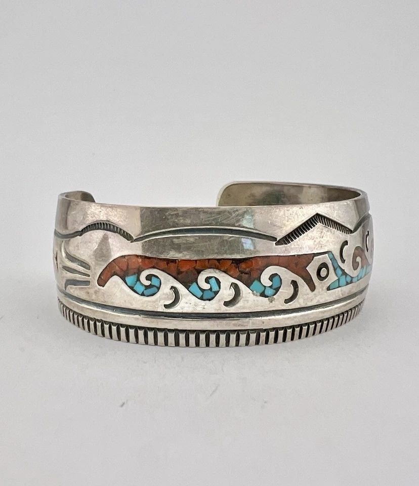VTG NAVAJO STERLING SILVER CHIP TURQUOISE & CORAL WAVE FLUSH INLAY CUFF BRACELET: Vtg Navajo Sterling Silver Chip Turquoise & Coral Wave Flush Inlay Cuff Bracelet Cuff is 5 1/4" tip to Tip and has a 1 1/8" Wide Gap Cuff Is 7/8" Wide In the Center Weight is 31.9 Grams on my scale Te