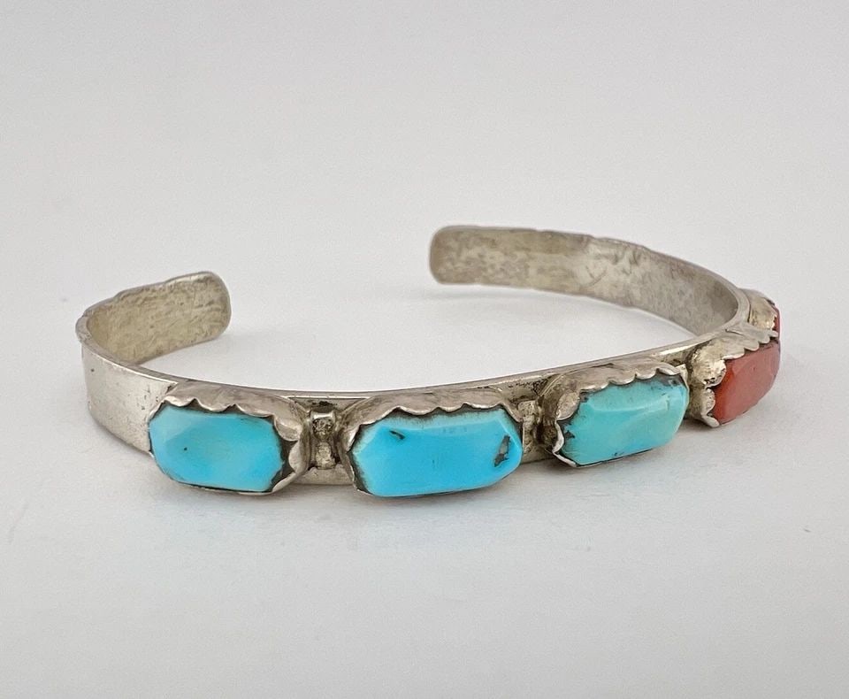 VTG A PENKETEWA ZUNI TURQUOISE & RED CORAL STERLING SILVER STAMPED CUFF BRACELET: VTG A PENKETEWA ZUNI TURQUOISE & RED CORAL STERLING SILVER STAMPED CUFF BRACELET Vtg A. Penketewa Zuni Turquoise & Red Coral Sterling Silver Stamped Cuff Bracelet Cuff is 5 1/8" tip to Tip and has a 1