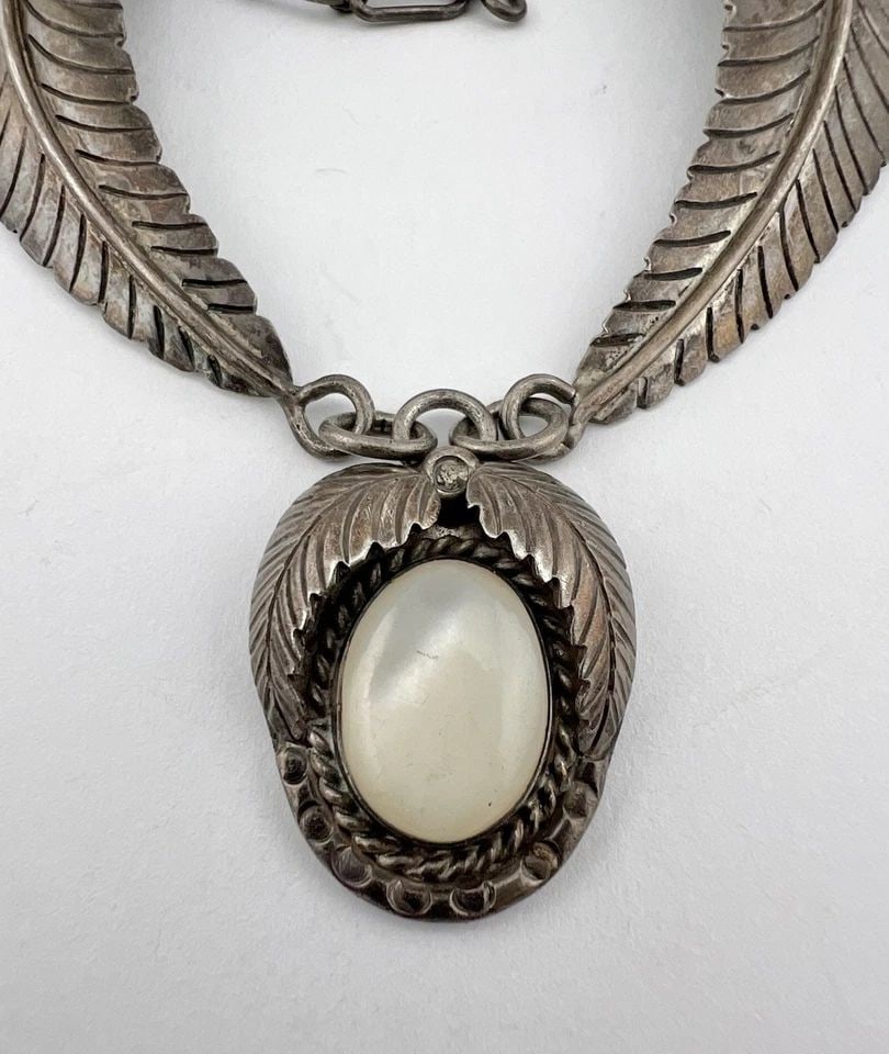 VTG NAVAJO STERLING SILVER MOTHER OF PEARL STAMPED BIB COLLAR NECKLACE 14.75": HVtg Navajo Sterling Silver Mother Of Pearl Stamped Bib Collar Necklace 14.75" MEASUREMENTS: Necklace measures 14 3/4" tip To tip Center Pendant is Over 1 1/4" Tall With Bail By Just Under 1" Wide WEI