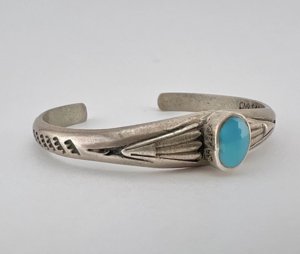 OLD PAWN NAVAJO INGOT SANDCAST STERLING SILVER TURQUOISE STAMPED CUFF BRACELET: OLD PAWN NAVAJO INGOT SANDCAST STERLING SILVER TURQUOISE STAMPED CUFF BRACELET Old Pawn Navajo Sandcast Sterling Silver Oval Turquoise Stamped Cuff Bracelet Cuff is 5 1/8" tip to Tip and has a 1" Wide