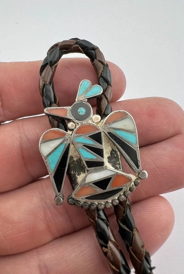 EARLY 1940S FRANK VACIT ZUNI STERLING SILVER MULTI GEMSTONE THUNDERBIRD BOLO TIE: EARLY 1940S FRANK VACIT ZUNI STERLING SILVER MULTI GEMSTONE THUNDERBIRD BOLO TIE Early 1940s Frank Vacit Zuni Sterling Silver Multi Gemstone Thunderbird Bolo Tie Size: 1 3/8" Tall by 1 1/8" Wide Weigh