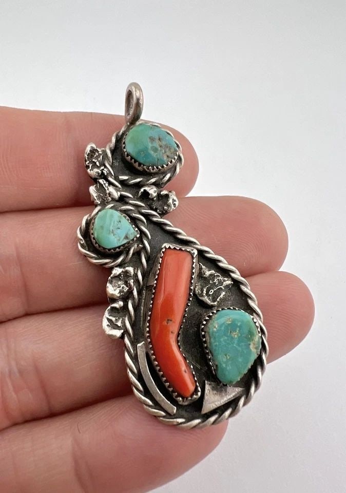 VINTAGE NAVAJO STERLING SILVER HIGH GRADE BLUE TURQUOISE & CORAL PENDANT 2.25": Vintage Navajo Sterling Silver High Grade Blue Turquoise & Coral Pendant 2.25" Size: 2 1/4" Tall With bail by 1" Wide Weight is 11.2 Grams on my scale Test Positive For Sterling Silver Amazing Natural