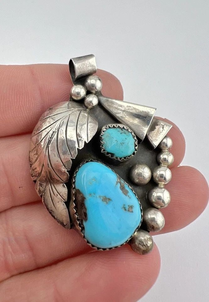 VINTAGE ZUNI STERLING SILVER BLUE KINGMAN TURQUOISE STAMPED PENDANT 2": VINTAGE ZUNI STERLING SILVER BLUE KINGMAN TURQUOISE STAMPED PENDANT 2" Vintage ZUNI Sterling Silver Blue Kingman Turquoise Stamped Pendant 2" Size: About 2" Tall With bail by 1 3/8" Wide Weight is 13.