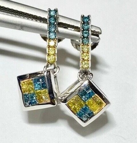 TRIPLE EARRING DISPLAY: TRIPLE EARRING DISPLAY TRIPLE EARRING DISPLAY This elegant jewelry display is perfect for showcasing your favorite earrings. Crafted with care, it is suitable for any type of earring and comes with a