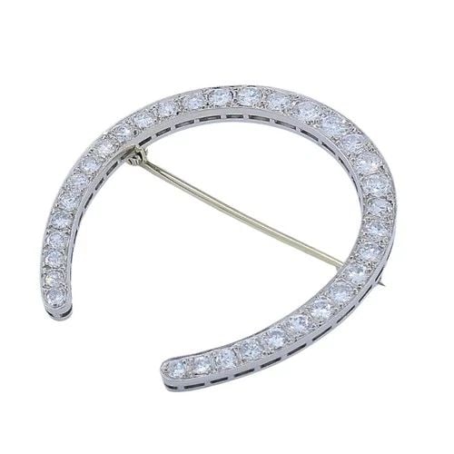 EDWARDIAN PLATINUM DIAMOND HORSESHOE BROOCH: EDWARDIAN PLATINUM DIAMOND HORSESHOE BROOCH MATERIALS Platinum GEMSTONE Diamonds WEIGHT 10.7 Grams MEASUREMENTS 3/16” x 1 5/8” ITEM DETAILS Edwardian Platinum Diamond Horseshoe Brooch This