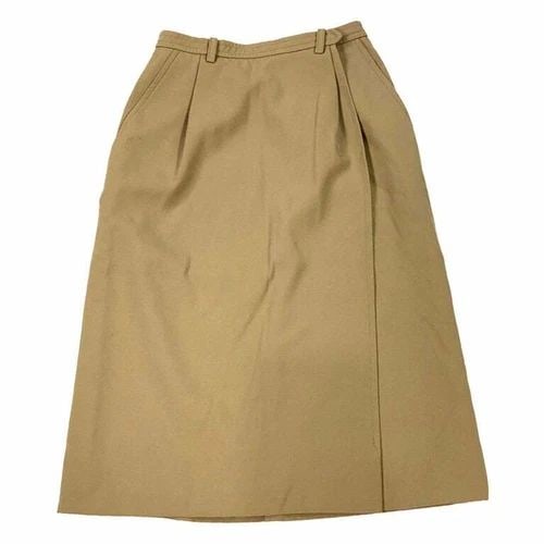 YVES SAINT LAURENT RIVE GAUCHE PARIS BROWN SKIRT, SIZE 36: YVES SAINT LAURENT RIVE GAUCHE PARIS BROWN SKIRT, SIZE 36 YVES SAINT LAURENT RIVE GAUCHE PARIS BROWN SKIRT, SIZE 36 The skirt is made out of 100% wool, it features wrap around design and pockets on ea