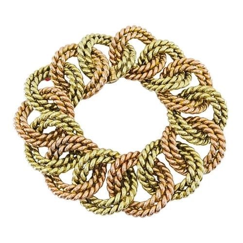VERDURA 14K TWO-TONE GOLD ROPE LINK BRACELET: VERDURA 14K TWO-TONE GOLD ROPE LINK BRACELET ES JUOOO Product details: DESIGNER: Verdura CIRCA: 1960s MATERIALS: 14k Gold WEIGHT: 118.2 Grams MEASUREMENTS: 7/8" x 7 1/2" HALLMARKS: Verdura, 14K ITEM D
