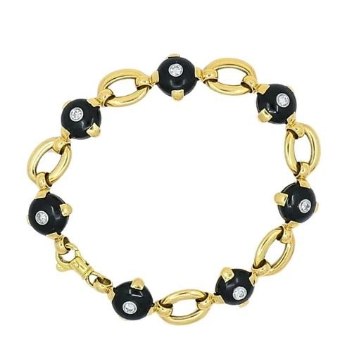 MARZO PARIS 18K GOLD ONYX DIAMOND BRACELET: MARZO PARIS 18K GOLD ONYX DIAMOND BRACELET Product details: DESIGNER: Marzo Paris CIRCA: 1930’s MATERIALS: 18k Yellow Gold GEMSTONE: Onyx, Diamond WEIGHT: 31.7 Grams MEASUREMENTS: 7.5" x 7/16" HALLM