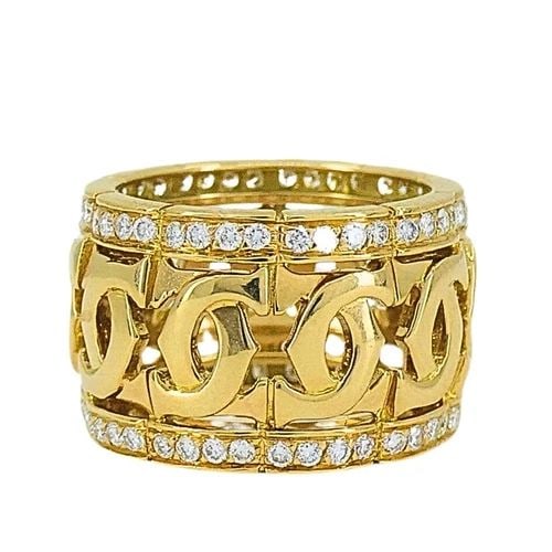 CARTIER ENTRELACES C DE CARTIER DIAMOND RING WIDE BAND: CARTIER ENTRELACES C DE CARTIER DIAMOND RING WIDE BAND Product details: DESIGNER: Cartier CIRCA: 1990’s MATERIALS: 18k Yellow Gold GEMSTONE: 0.65 cts Round Brilliant Cut Diamond WEIGHT: 12.6 Grams M