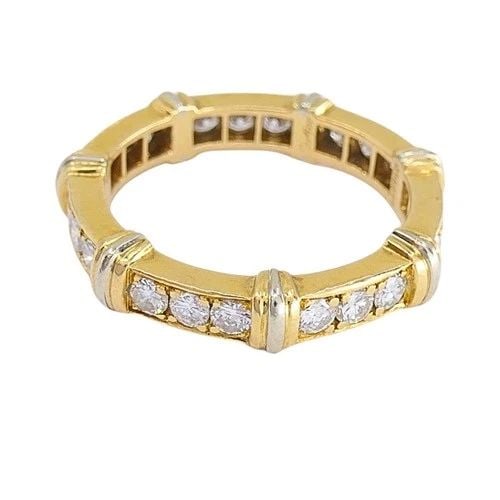 CARTIER 18K GOLD CONTESSA DIAMOND ETERNITY BAND RING: CARTIER 18K GOLD CONTESSA DIAMOND ETERNITY BAND RING DESIGNER Cartier CIRCA 1990s MATERIALS 18k Gold GEMSTONE Diamonds WEIGHT 4.3 Grams MEASUREMENTS 1/8” RING SIZE 5.75 - 6 (52) - not resizable 