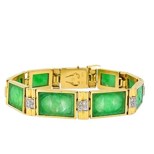 VINTAGE 18K GOLD JADE DIAMOND BRACELET: VINTAGE 18K GOLD JADE DIAMOND BRACELET CIRCA: Mid-20th Century MATERIALS: 18k Gold GEMSTONE: Jade, Diamond WEIGHT: 34.1 Grams MEASUREMENTS: 7” x 3/8" HALLMARKS: 18K, 750 ITEM DETAILS: Vintage 18