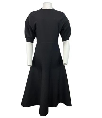 CHRISTIAN DIOR BLACK WOOL MIDI DRESS, SIZE 6: CHRISTIAN DIOR BLACK WOOL MIDI DRESS, SIZE 6 CHRISTIAN DIOR BLACK WOOL MIDI DRESS, SIZE 6 The dress features crew neck line, short balloon sleeves, midi length flare skirt, rear zip closure and knit f
