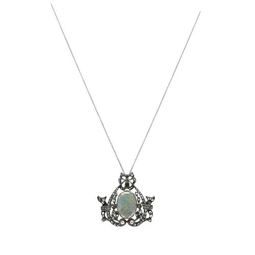 VINTAGE OPAL DIAMOND PENDANT 10K GOLD SILVER AND 18K GOLD CHAIN: VINTAGE OPAL DIAMOND PENDANT 10K GOLD SILVER AND 18K GOLD CHAIN Product details: DESIGNER: Unknown CIRCA: Early 20th Century MATERIALS: 18k Gold Chain, 10k Gold Silver Pendant GEMSTONE: Opal, Diamond 