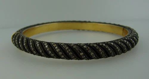 CHIC DIAMOND SILVER YELLOW GOLD BANGLE BRACELET: CHIC DIAMOND SILVER YELLOW GOLD BANGLE BRACELET Chic Diamond, Silver & Yellow Gold Bangle Bracelet Chic and elegant bracelet that is a great addition to your collection. Weight is 26.8 grams. Made of 