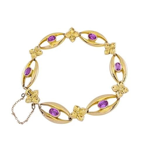BRITISH 9K GOLD PINK SAPPHIRE LINK BRACELET: BRITISH 9K GOLD PINK SAPPHIRE LINK BRACELET ES RTO Product details: MATERIALS: 9k Gold GEMSTONES: Sapphire WEIGHT: 11.4 Grams ITEM DETAILS: British 9k Gold Pink Sapphire Link Bracelet A British bracel