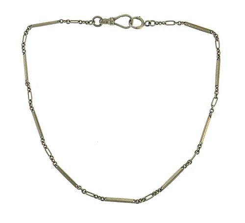 VICTORIAN GOLD WATCH CHAIN ANTIQUE: VICTORIAN GOLD WATCH CHAIN ANTIQUE Victorian White Gold Watch Chain Victorian watch chain created in the 1920s. Made of 14 karat (stamped) white gold. Measurements: 12-1/2 x 1/16 inches (32 x 0.2 cm).