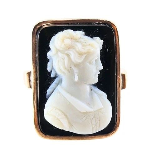 ANTIQUE RING 14K CARVED CAMEO: ANTIQUE RING 14K CARVED CAMEO DESIGNER: Unknown CIRCA: 1900s MATERIALS: 14k Gold WEIGHT: 5.5 Grams RING SIZE: 6.5 MEASUREMENTS: 1/2" x 3/4" HALLMARKS: 14K ITEM DETAILS: Antique Ring 14k Carved Cameo T