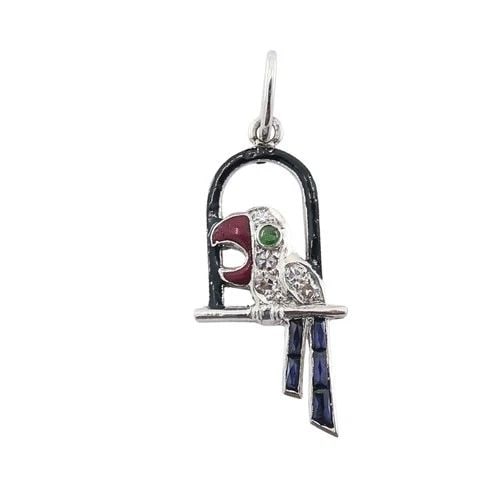 ANTIQUE PLATINUM PARROT CHARM GEMSTONE DIAMOND ACCENTS: ANTIQUE PLATINUM PARROT CHARM GEMSTONE DIAMOND ACCENTS MATERIALS Platinum, Enamel GEMSTONE Diamond WEIGHT 1.9 Grams MEASUREMENTS 1/4" x 3/4" ITEM DETAILS Antique Platinum Parrot Charm Gemstone Diamond