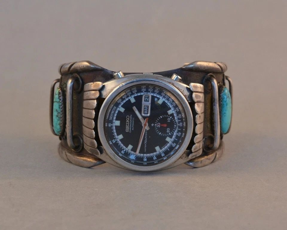 VTG NAVAJO SILVER TURQUOISE MENS WATCH BRACELET CUFF 1970S SEIKO WATCH - 7 1/8": VTG NAVAJO SILVER TURQUOISE MENS WATCH BRACELET CUFF 1970S SEIKO WATCH - 7 1/8" This vintage Navajo sterling silver watch bracelet cuff has been expertly crafted by Navajo silversmith Lewis (Hogan) Be
