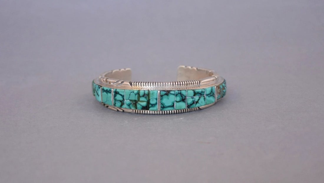 THOMAS FRANCISCO - NAVAJO STERLING SILVER BRACELET CUFF - TURQUOISE - 6 3/4": This vintage sterling silver bracelet has been beautifully crafted by Navajo silversmith Thomas Francisco. It has thick sterling with a beautifully chiselled top and bottom edge. It looks like a coupl