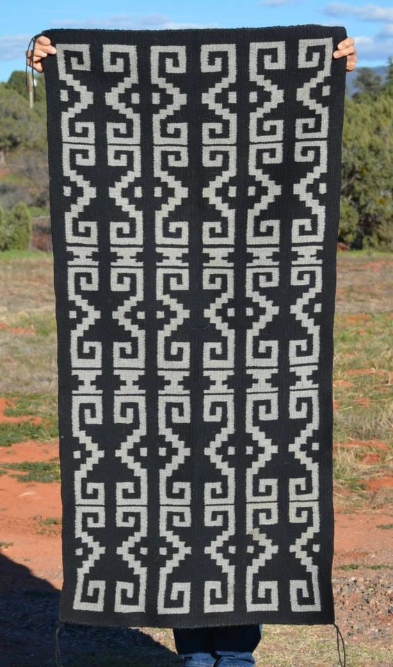 VINTAGE NAVAJO RUG - UNIQUE GREY ON BLACK DESIGN - BEAUTIFULLY WOVEN - 59" X 28": VINTAGE NAVAJO RUG - UNIQUE GREY ON BLACK DESIGN - BEAUTIFULLY WOVEN - 59" X 28" This beautifully woven Navajo rug shows a unique grey on black design. The rug measures 59" long by 28" wide. This rug 