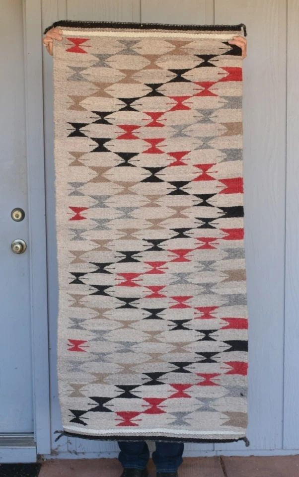 VINTAGE NAVAJO RUG - HOURGLASS ZIG ZAG DESIGN - 59" X 26" - GREAT FLOOR RUG: VINTAGE NAVAJO RUG - HOURGLASS ZIG ZAG DESIGN - 59" X 26" - GREAT FLOOR RUG This vintage Navajo rug has a lightning design hourglass design. It has been nicely woven of thick wools and would make a gr