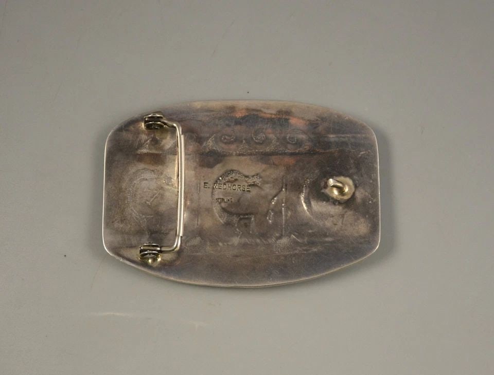 LG VINTAGE NAVAJO STERLING SILVER BUCKLE -BY ERVIN REDHORSE - 3.5" X 2.5" 60GM: LG VINTAGE NAVAJO STERLING SILVER BUCKLE -BY ERVIN REDHORSE - 3.5" X 2.5" 60GM Item Description: This vintage sterling silver buckle shows a scene with Kokopelli playing flutes. Kokopelli arrive in th