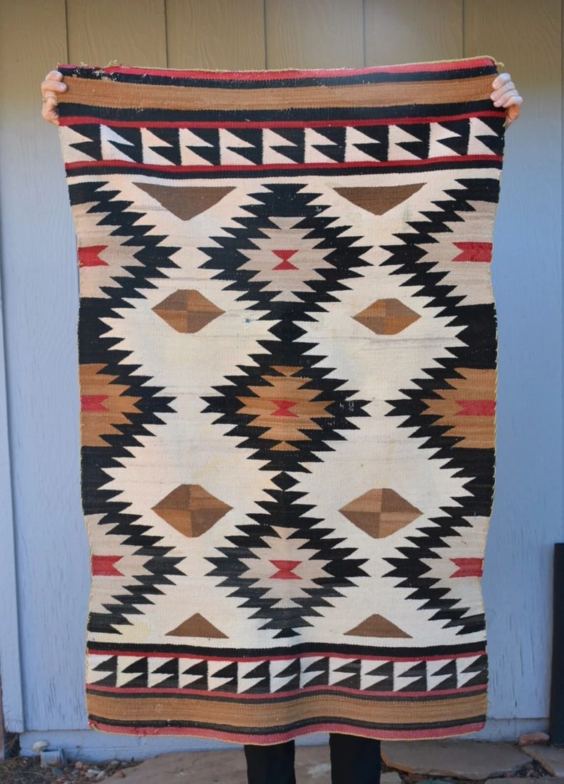 OLD RED MESA NAVAJO RUG - DIAMOND DAZZLER DESIGN - 52" X 33" WHITE RED BROWN: This old Red Mesa diamond eyedazzler Navajo rug shows a great design. It measures 52" x 33". There are some holes here and there and some light staining. This rug is in fair condition. See pictures fo