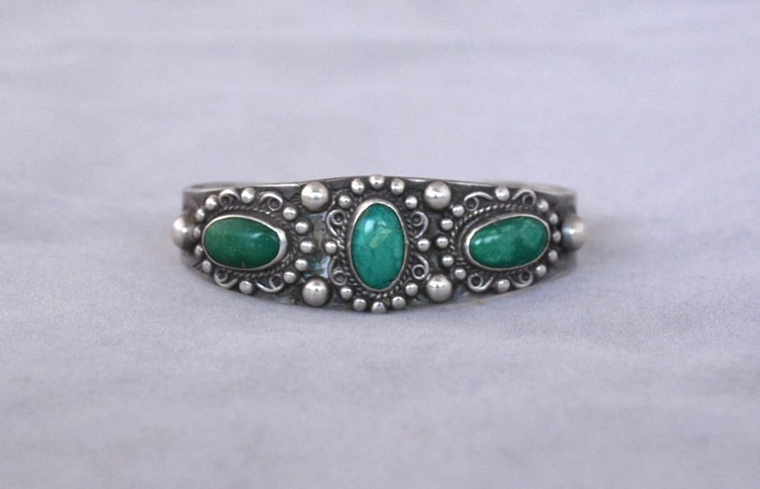 OLD PAWN NAVAJO STERLING SILVER BRACELET - 3 TURQUOISE STONES W. APPLIQUE - 5.75: This old Pawn Navajo sterling silver bracelet has been set with three turquoise stones surrounded with silver raindrop beads. The front of the bracelet is 3/4" tall. The bracelet size is 4 7/8" around