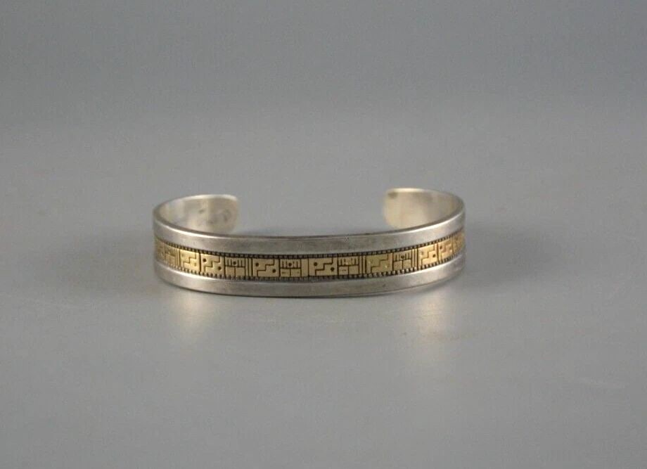 RODERICK TENORIO - SANTO DOMINGO KEWA SOLID 14 KARAT GOLD ON STERLING SILVER: RODERICK TENORIO - SANTO DOMINGO KEWA SOLID 14 KARAT GOLD ON STERLING SILVER Item Description: This vintage Solid 14 karat gold on sterling silver bracelet has been beautifully crafted by well known K