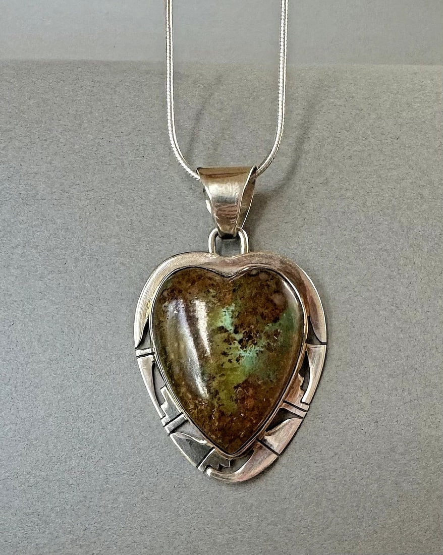 P SANCHEZ NAVAJO STERLING SILVER AND TURQUOISE HEART NECKLACE ..: 1 5/8 " Tall 1 " Wide .. 17 " Sterling Chain .. 17 Grams Throughout the 40 years that I have been in business, I have purchased jewelry from pawn shops throughout the Southwest that had collections of