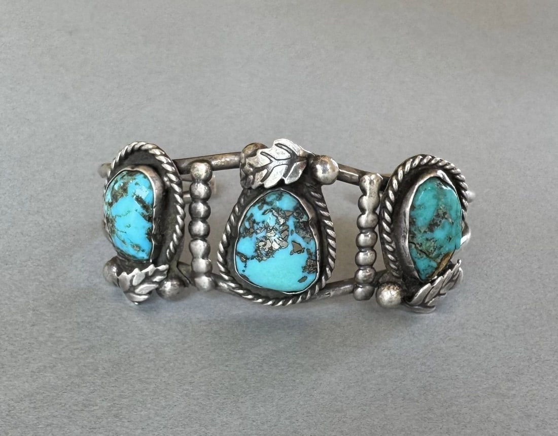 OLD PAWN NAVAJO STERLING SILVER AND TURQUOISE BRACELET: 1 1/8 " Wide .5 1/2 Inside With a 1 1/4 " Opening ...34.5 Grams One Stone has Has a crack .. But Still Secure in its setting .. Nice old bracelet Throughout the 40 years that I have been in business, 