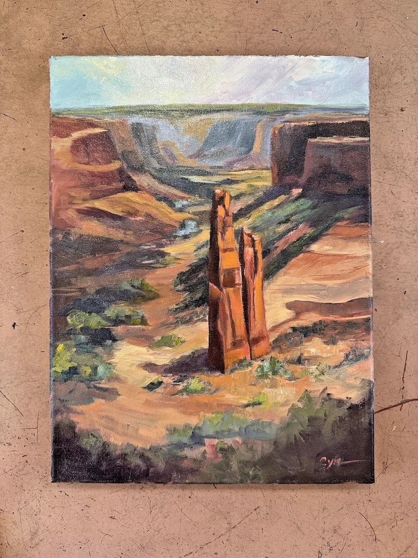 "CYNDI THAU" CANYON DE CHELLY SPIDER ROCK PLEIN AIR PAINTING: 16" x 12" Oil on Board. Cyndi Thau was born in Arizona and has travelled widely including through South and Central America. For many years Cyndi resided in the peaceful region of Oak Creek Canyon, no