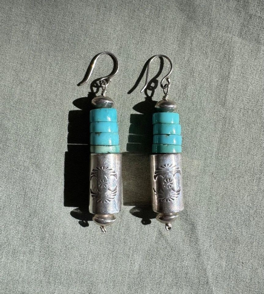 VINTAGE SANTO DOMINGO STERLING SILVER AND TURQUOISE EARRINGS 2 3/8" DROP: VINTAGE SANTO DOMINGO STERLING SILVER AND TURQUOISE EARRINGS 2 3/8" DROP 2 3/8" Drop 1/2" Wide 12 Grams Throughout the 40 years that I have been in business, I have purchased jewelry from pawn shops t