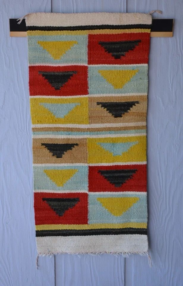 UNIQUE OLD NAVAJO RUG - OPTICAL DESIGN IN TURQUOISE YELLOW RED BLACK - 39" X 19": UNIQUE OLD NAVAJO RUG - OPTICAL DESIGN IN TURQUOISE YELLOW RED BLACK - 39" X 19" This old Navajo rug is in good condition. It has a unique design with unique colors. It measures 39" x 19". One side ha